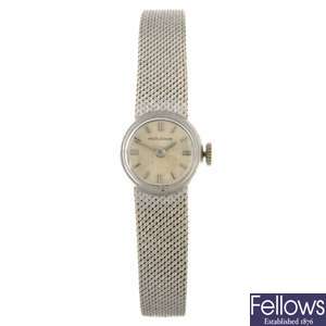 An 18k white gold manual wind lady's Jaeger-LeCoultre bracelet watch.