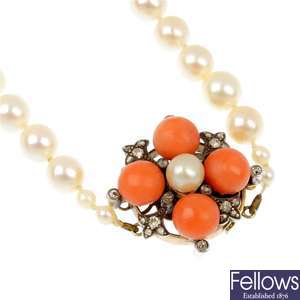 A cultured pearl, coral and diamond necklace.