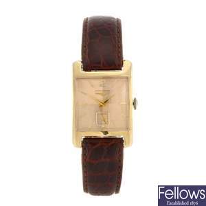 A 14k gold manual wind gentleman's Longines wrist watch.