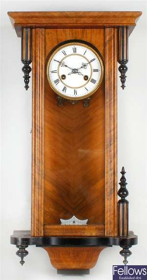 A late 19th century walnut and ebonised Vienna wall clock
