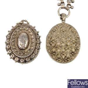 A Victorian silver locket and another locket and chain.