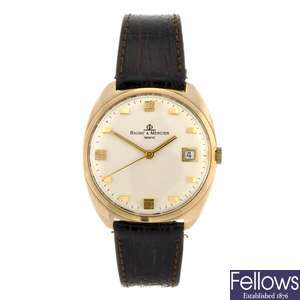 A 14k gold automatic gentleman's Baume & Mercier wrist watch.