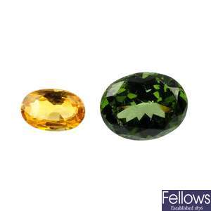 A yellow sapphire and a green gem-stone. 
