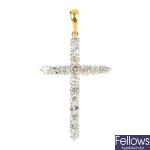 A diamond cross pendant.