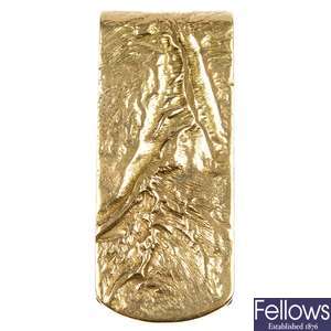 DUNHILL - a 9ct gold reticulated money clip.