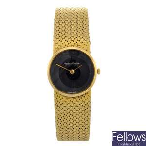 An 18k gold manual wind lady's Jaeger-LeCoultre bracelet watch.