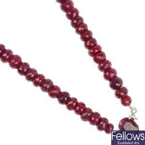 A glass filled, colour treated ruby necklace.