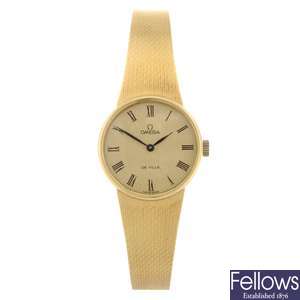(301149823)  An 18k gold manual wind lady's Omega De Ville bracelet watch.