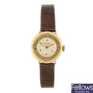 An 18k gold manual wind lady's Vertex wrist watch.