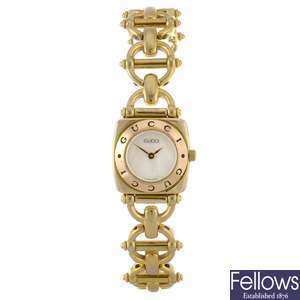 A gold plated quartz lady's Gucci 6400L bracelet watch.