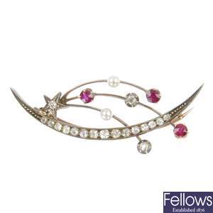 A late 19th century diamond, ruby and cultured pearl cresent brooch.