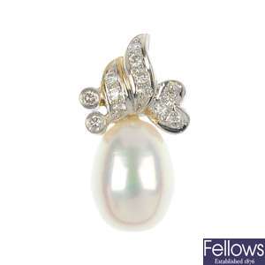 Two identical freshwater cultured pearl and diamond pendants.