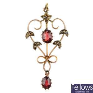 An early 20th century garnet and seed pearl pendant.