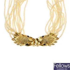 An imitation pearl twelve-row necklace with paste clasp, a bog oak necklace & a plastic bead necklac
