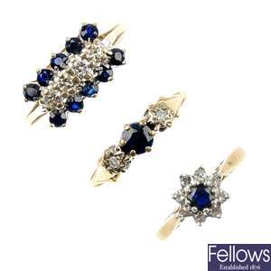 An assortment of four sapphire and diamond rings.
