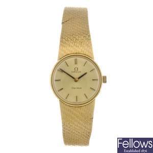 A gold plated manual wind lady's Omega bracelet watch.Together with a gent's example.