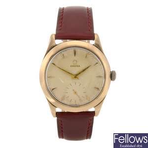A 14k rose gold manual wind gentleman's Omega wrist watch.