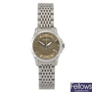 (707004352) A stainless steel quartz lady's Gucci G-Timeless bracelet watch.