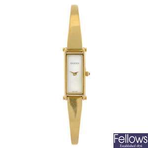 (304285875) A gold plated quartz lady's Gucci 1500L bracelet watch.