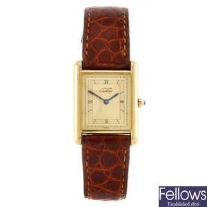 A gold plated quartz gentleman's Cartier Must De Cartier Tank wrist watch.