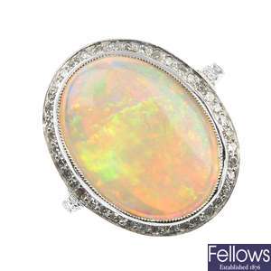 A platinum opal and diamond cluster ring.