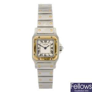 (134175447) A bi-metal quartz lady's Cartier Santos bracelet watch.