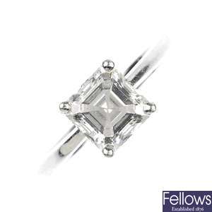 (526433-1-A) A platinum diamond square shape diamond ring.