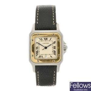 (526472-1-A) A bi-metal quartz gentleman's Cartier Santos wrist watch.