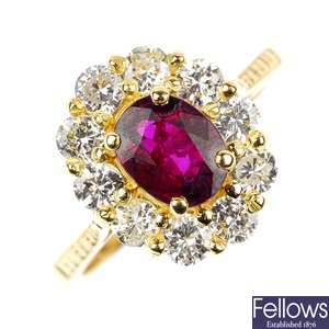 An 18ct gold ruby and diamond cluster ring. 