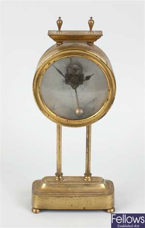 An early 20th century brass gravity clock