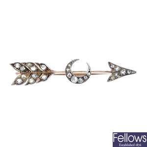 A late 19th century silver and gold diamond arrow and crescent brooch.