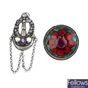 An early 20th century silver continental paste pendant and an enamel brooch. 