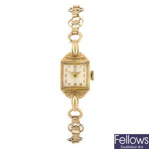 A 9ct gold manual wind lady's Tudor bracelet watch with a Trax gentleman's watch head.