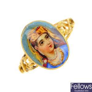 An early 20th century 22ct gold enamel portrait ring.