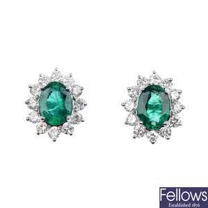 A pair of emerald and diamond cluster ear studs.