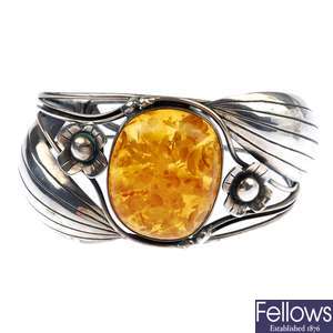 A reconstituted amber bangle and pendant.