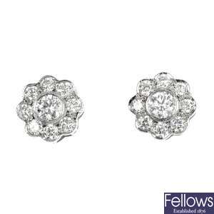 A pair of diamond floral cluster ear studs.