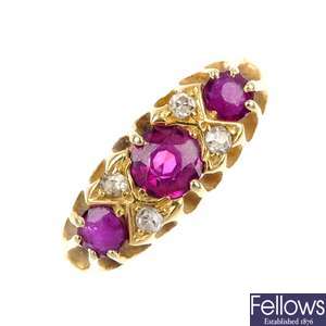 An early 20th century 18ct gold ruby three-stone ring.