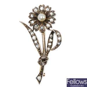 An early 20th century gold and silver seed pearl and diamond flower brooch.