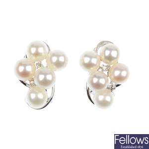 A pair of cultured pearl and diamond ear studs. 