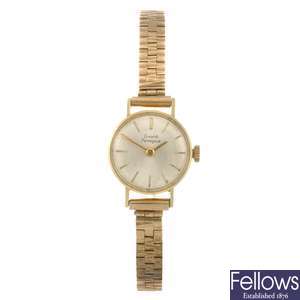 (504004710)  An 18k gold manual wind lady's Girard-Perregaux bracelet watch.