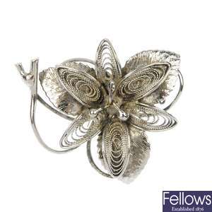 A selection of silver and white metal filigree jewellery.