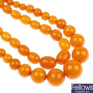 A reconstituted amber necklace and a bakelite necklace.