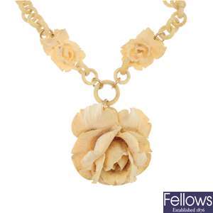 A set of ivory rose jewellery.
