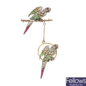 An Art Deco gold and silver gilt paste parrot brooch.