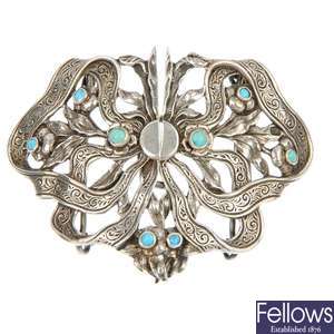 An Edwardian cased silver and turquoise buckle and an enamel buckle.