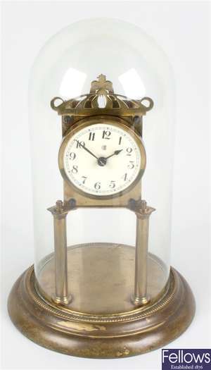 A 1920's brass torsion or 'anniversary' clock