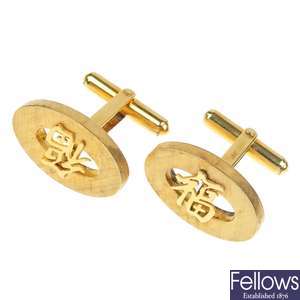 Two pairs of mid 20th century 9ct gold Asian character cufflinks.