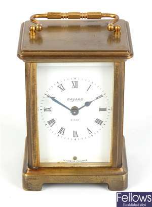 A brass carriage clock retailed by Bayard