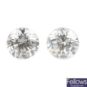 Two brilliant-cut diamonds, weighing 0.33 and 0.32ct.